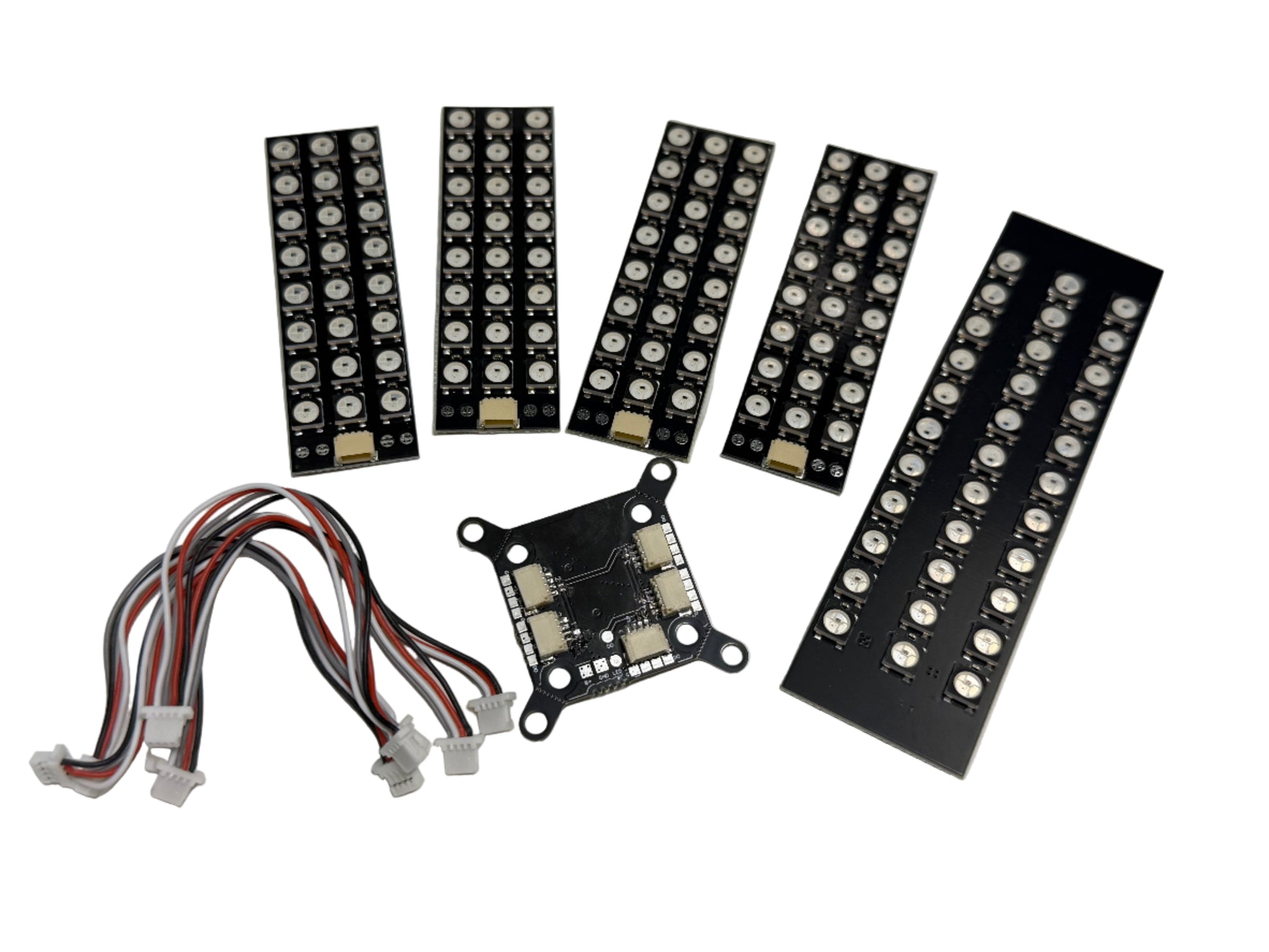 Set of LED strip boards and connectors on a white background